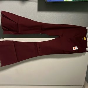 Maroon High waisted flare pants super stretch! Brand new. Rips on knee